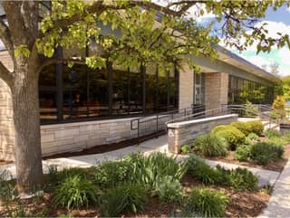 The Tecumseh District Library building and gardens