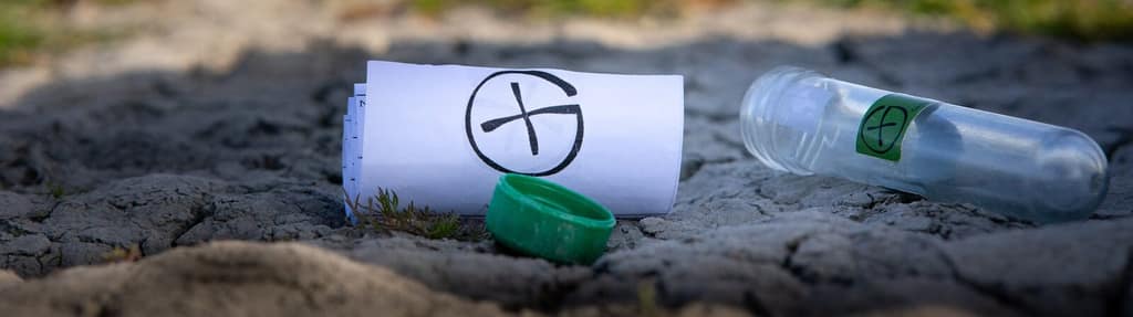 A geocache container hidden among stones