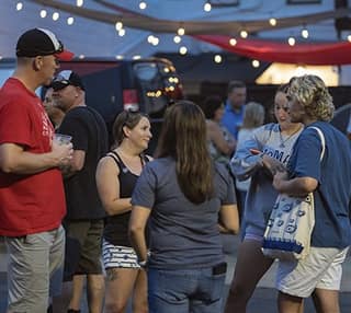 Neighbors gathered at a downtown Tecumseh event