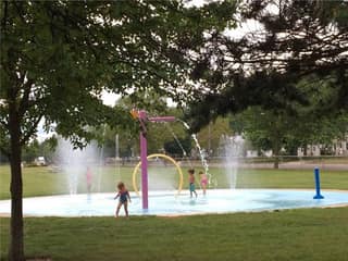 Children playing at the Cal Zorn Park splash pad